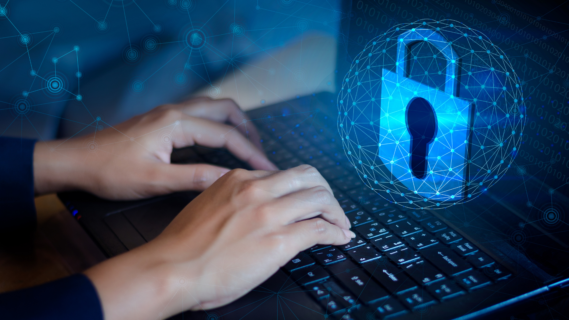 Telecom professional implementing cyber security on laptop