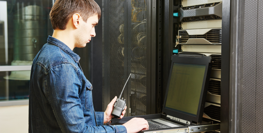 Network engineer configuring network in server room