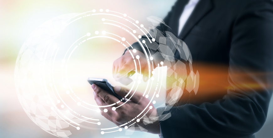 Man in suit using mobile phone with wireless mobile technology