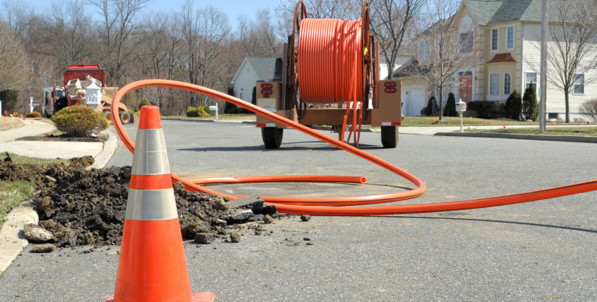 Conduit roll for laying fiber optic lines in residential estate