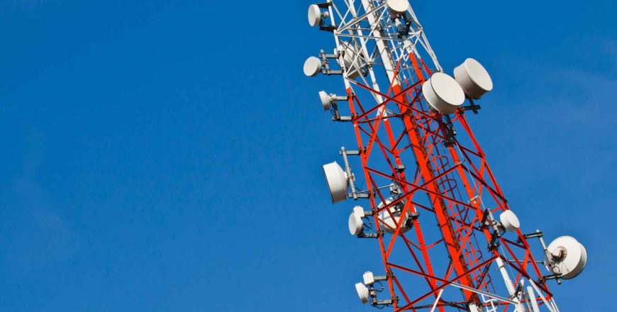 Radio transmission tower against sky background