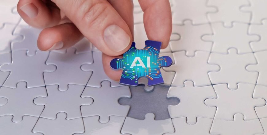 A hand places the last piece of the puzzle piece labelled AI