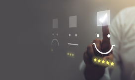 Telecom customer pressing smiley face emoticon on virtual touch screen to indicate customer satisfaction and evaluate service
