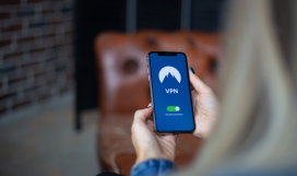 Telecom professional configuring Virtual Private Network (VPN) to mask IP address on mobile phone