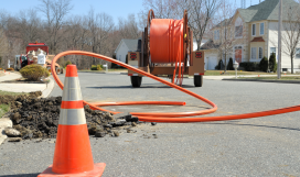 Conduit roll for laying fiber optic lines in residential estate