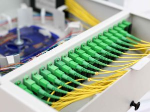 Fiber optic cables installed neatly in a cabinet for fiber to the home internet service FTTH