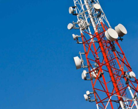 Radio transmission tower against sky background