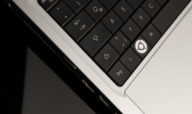 Computer with Ubuntu software logo on keyboard