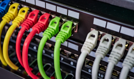 Multi-coloured ethernet cables connected to router